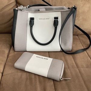 Micheal Kors purse and wallet. A few small stains inside bottom of purse